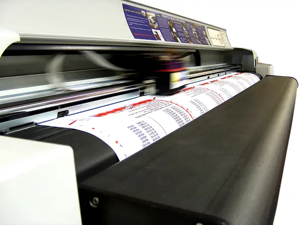A closeup of a large format printer